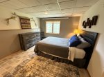 Lower level bedroom 5 with queen bed